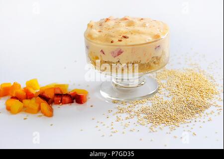 Healthy breakfast concept. Quinoa Granola with yogurt, fruits, seeds, honey, on white background Stock Photo