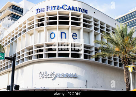 Miami Beach, USA - May 5, 2018: The Ritz-Carlton, Ritz Carlton hotel, resort, spa, Walgreens pharmacy signs on Collins Avenue near Ocean Drive Art Dec Stock Photo