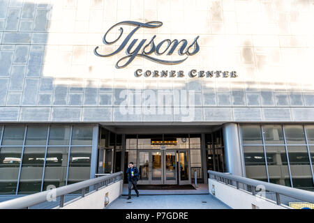 Tysons, USA - January 26, 2018: Sign, entrance doors on bridge to Tyson's Corner Mall in Fairfax, Virginia by Mclean with people walking Stock Photo