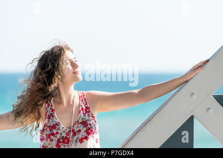 an easel with a picture stands on the seashore without people on a sunny  day Stock Photo - Alamy