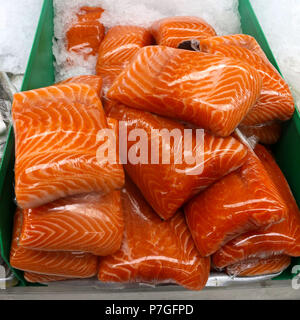 Wild raw salmon fillets on ice at fish market Stock Photo