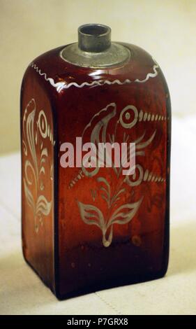 Wine bottle. Brown glass, metal; blown, painted. St. Petersburg Glassworks. First half of the 18th century. From the collectio of Princes Argutinsky-Dolgorukov. The State Hermitage Museum. Saint Petersburg. Russia. Stock Photo