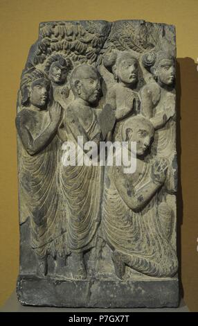 Asian Art. Monks and laymen from a scene of the Buddha sermon. Slate. Gandhara. 2nd-3rd centuries. AD. Until 1945. Musuem fur Volkerhunde, Berlin, Germany. Stock Photo