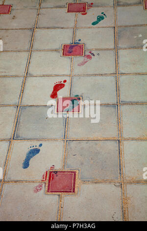 Painted traces on the sidewalk. Texture of paving slabs. Stock Photo