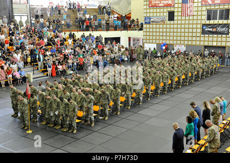 Soldiers from the 1245th Transportation Company, assigned to 1st Cavalry Division attend a deployment ceremony July 2 at East Central University, Ada, Oklahoma. Family members, friends and fellow Soldiers were on hand at the ceremony to wish their loved ones well before their deployment to the Middle East. (U.S. Army National Guard photo by Sgt. Brian Schroeder) Stock Photo