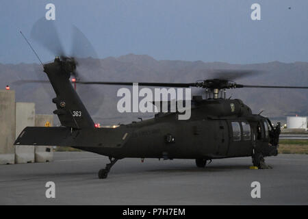 A UH-60 Blackhawk helicopter assigned to Task Force Shadow conducts a pre flight run-up and health indicator test to validate engine performance prior to take off July 2. Stock Photo