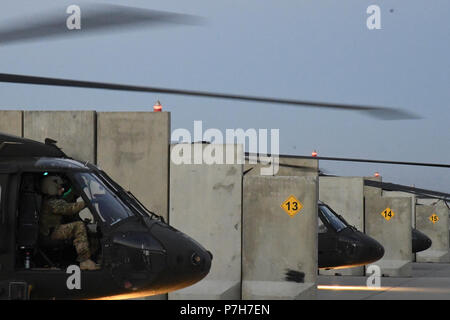 A UH-60 Blackhawk helicopter assigned to Task Force Shadow conducts a pre flight run-up and health indicator test to validate engine performance at Bagram Airfield, July 2. Stock Photo