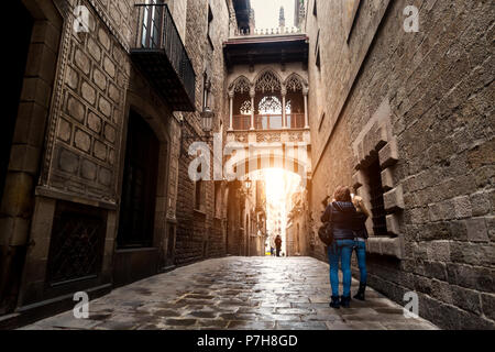 Woman tourist sightseeing in Barcelona Barri Gothic Quarter and Bridge of Sighs in Barcelona, Catalonia, Spain. Stock Photo