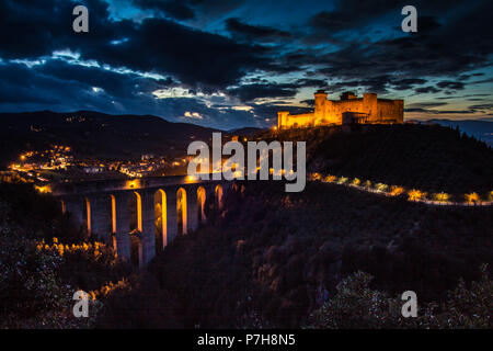 Save Download Preview Sunset over the highlighted castle in Spoleto, Italy Stock Photo