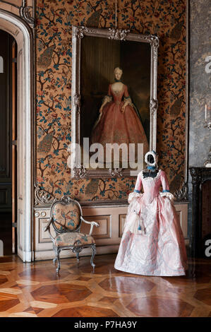 Mannequin wearing paper 18th century style dress by painting in Neues Palais Stock Photo