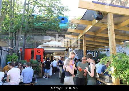 Trendy Brick Brewery beneath the arches of Peckham Rye station on Blenheim Grove, in south London, UK Stock Photo