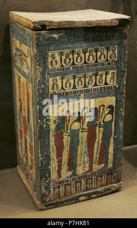 Box containing shawabti. The wooden box is decorated with paintings of different deities. Tomb of Ahmose priest. The State Hermitage Museum. St. Petersburg. Russia. Stock Photo