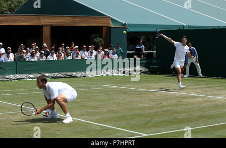 Frederik Nielsen and Joe Salisbury (right) during the doubles on day five of the Wimbledon Championships at the All England Lawn Tennis and Croquet Club, Wimbledon. Stock Photo