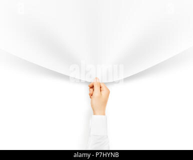 Hand holding blank banner corner. Clear cloth pulling out. Empty space decorative design element. Drag out edge of sticker. Banner mock up holding hand. Blank cloth mockup hold arm. Stock Photo
