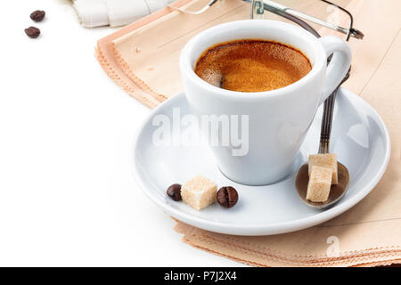 Coffee and newspapers isolated on white background. Stock Photo