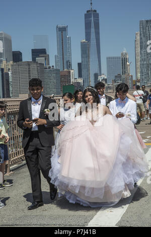 Quinceañera, quince años and quince) is a celebration of a girl's 15th birthday. It has its cultural roots in Latin America but is widely celebrated today throughout the Americas. The girl celebrating her 15th birthday is a quinceañera. Birthday girl with family & friends walks across the Brooklyn Bridge in NYC. Stock Photo
