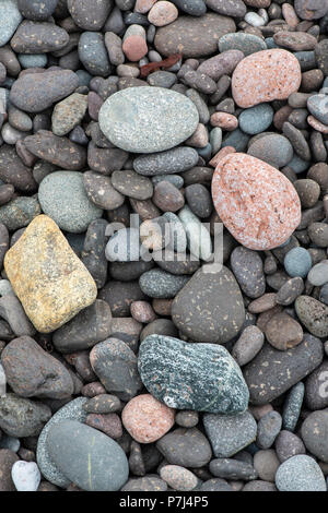 Coloured pebbles on beach. Shetland, UK. Stock Photo