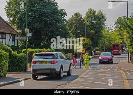 Lollipop Lady on duty Stock Photo