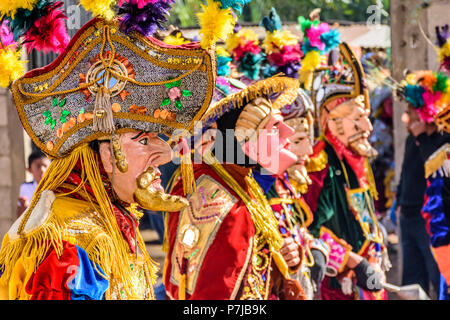 Parramos, Guatemala - December 29, 2016: Traditional folk dancers perform Dance of the Moors & Christians near UNESCO World Heritage Site of Antigua. Stock Photo