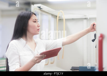 Female engineer holding a digital tablet Stock Photo