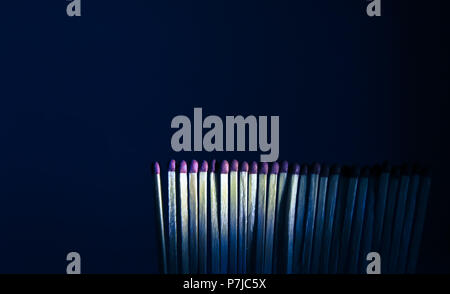 Matchsticks stacked beside each other, aligned matchsticks. unlit matchsticks. vertically standing matchsticks Stock Photo