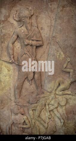 Victory stele of Naram-Sin, King of Akkad. Triumph of the king over a mountain of people, the Lullubi. King led his troops over the steep slopes of the enemy territory. Mesopotamia. Sipar. Akkadian period, c. 2250 BC. Detail of the king. Louvre Museum. Paris, France. Stock Photo