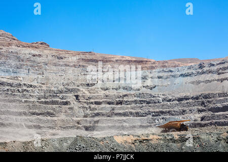 Huge dump trucks in an open pit Copper mine at northern Chile Stock Photo