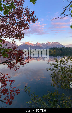 Sunset glow at Lake Barmsee, autumn, Karwendel Mountain Range, reflection, clouds Stock Photo