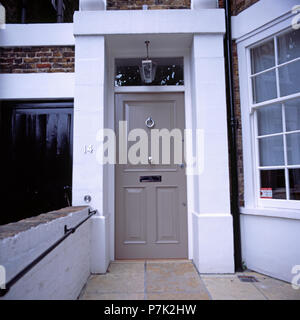 Grey front door of traditional townhouse Stock Photo