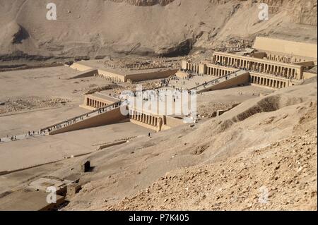 Temple Deir The Bahary. It means 'The northern convent' and is a complex of funerary temples and tombs that is located on the west bank of the Nile River, facing the ancient city of Thebes, the current Luxor, in Egypt. Stock Photo