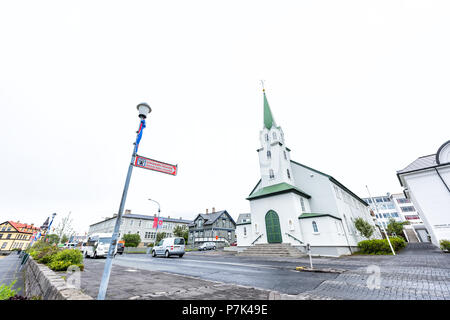 Reykjavik, Iceland - June 19, 2018: Independent Lutheran free church, Frikirkjan, with sign for Listasafn Islands National Gallery in downtown capital Stock Photo