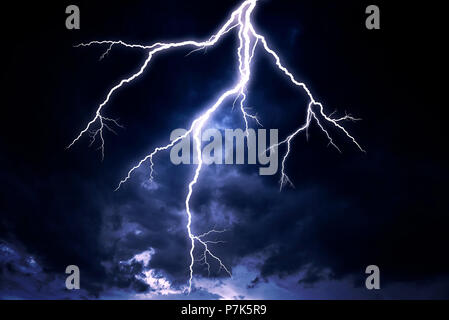 A lightning strike on a cloudy dramatic stormy sky Stock Photo - Alamy