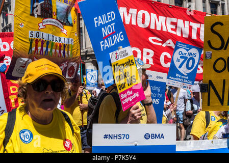 NHS 70th Anniversary March organised by People's Assembly, Migrants make our NHS, placard,, London, UK, 30/06/2018 Stock Photo