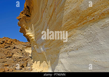 Banded Cliffs uncovered, colorfully banded, sandstone cliffs on the steep bank of a ...