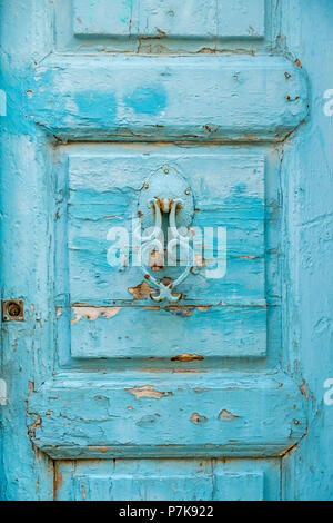 old turquoise door knocker in the old town of Rethymno, Europe, Crete, Greece Stock Photo