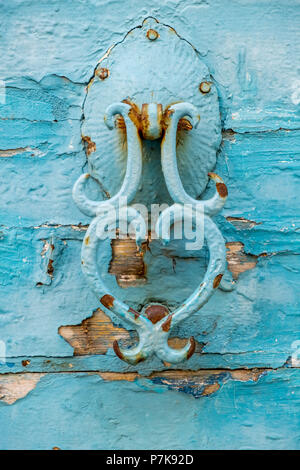 old turquoise door knocker in the old town of Rethymno, Europe, Crete, Greece Stock Photo
