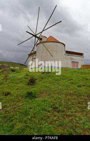 Windmill in the fishing village Carrapateira, Parque Natural do Sudoeste Alentejano and Costa Vicentina, Algarve Stock Photo