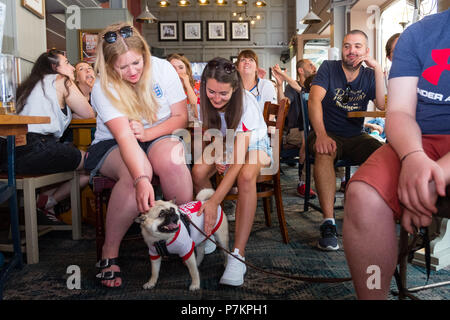 Wales, UK. 7th July 2018. World Cup 2018 : In the White Horse pub , Aberystwyth, happy England fans celebrate their team winning 2-0 against Sweden, and securing their place in the semi finals for the first time in 28 years.   Photo © Keith  Morris / Alamy Live News Stock Photo