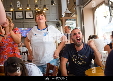 Wales, UK. 7th July 2018. World Cup 2018 : In the White Horse pub , Aberystwyth, happy England fans celebrate their team winning 2-0 against Sweden, and securing their place in the semi finals for the first time in 28 years.   Photo © Keith  Morris / Alamy Live News Stock Photo