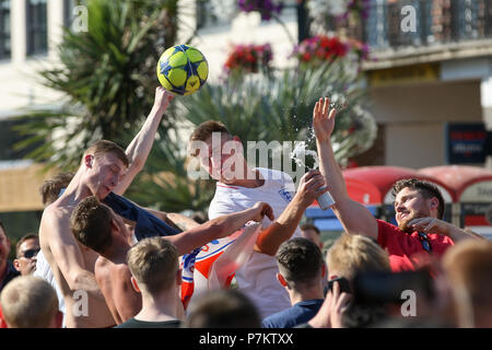 Bournemouth, UK. 7th July 2018.  England football fans celebrate with an impromptu kick about in Bournemouth Square after England's World Cup quarter final vistory over Sweden. Bournemouth, Dorset, UK. Credit: Richard Crease/Alamy Live News Stock Photo