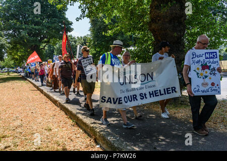 London, UK. 7th July 2018. Keep Our St Helier Hospital (KOSHH) campaigners against the closure of acute facilities at Epsom and St Helier Hospitals in south London celebrate the 70th Birthday of the NHS with a march from Sutton to a rally in front of St Helier Hospital.   he of sou Credit: Peter Marshall/Alamy Live News Stock Photo