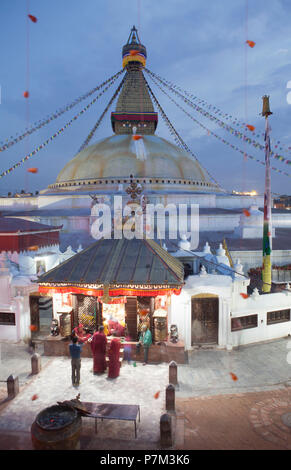 Monks shopping at the stall in temple grounds, Stupa Bodnath, Kathmandu, Nepal Stock Photo