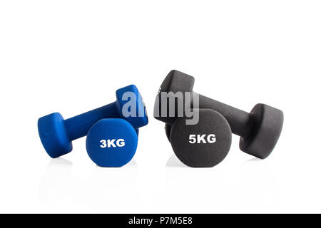 3kg and 5kg gym dumbbells isolated on a white background. Stock Photo