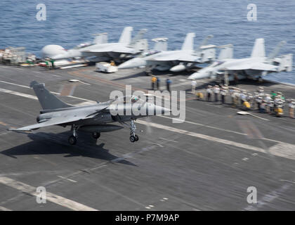 A French Rafale M aircraft prepares to land on USS Theodore Roosevelt ...
