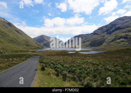 The Doolough Valley is a beautiful green valley of sloping mountainsides and a small lake on the valley floo, Connemara, County Mayo, Ireland. It is a Stock Photo