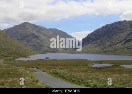 The Doolough Valley is a beautiful green valley of sloping mountainsides and a small lake on the valley floo, Connemara, County Mayo, Ireland. It is a Stock Photo