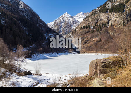 The iced Lago di Antrona in spring, Antrona Valley, Piedmont, Italy, Stock Photo