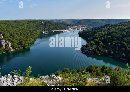 Town of Skradin on Krka river in Dalmatia, Croatia viewed from distance. Skradin is a small historic town and harbor. Stock Photo