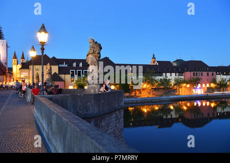 Germany, Bavaria, Upper Franconia Region, Würzburg, Statue on Old Main Bridge (Alte Mainbrücke) and Romanesque St. Kilian Cathedral at the background Stock Photo