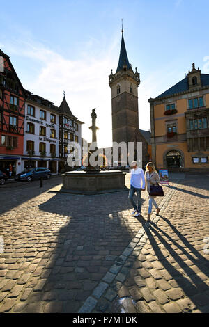 France, Bas Rhin, Obernai, market square, the chapel tower, Sainte Odile fountain and the town hall Stock Photo